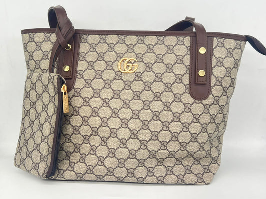 "شنطة توت باج حريمي - جلد لوجو ماركة عالمية - عملية وشيك (بـ محفظة صغيرة)"