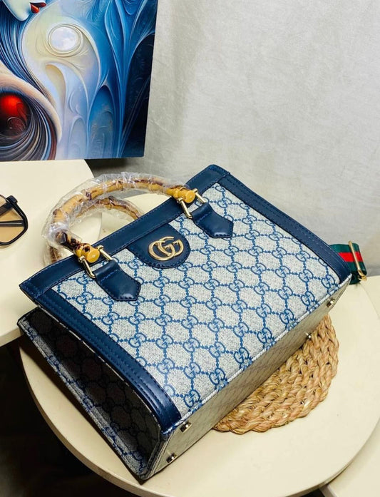 "شنطة يد حريمي صغيرة فخمة - يد بامبو و تصميم لوجو (Gucci Style)"